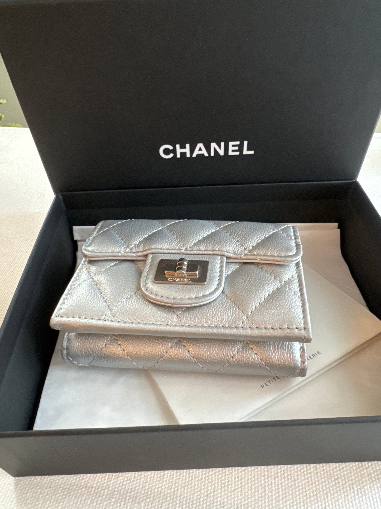 Chanel Matelasse small flap trifold wallet in silver . Boy turn lock
