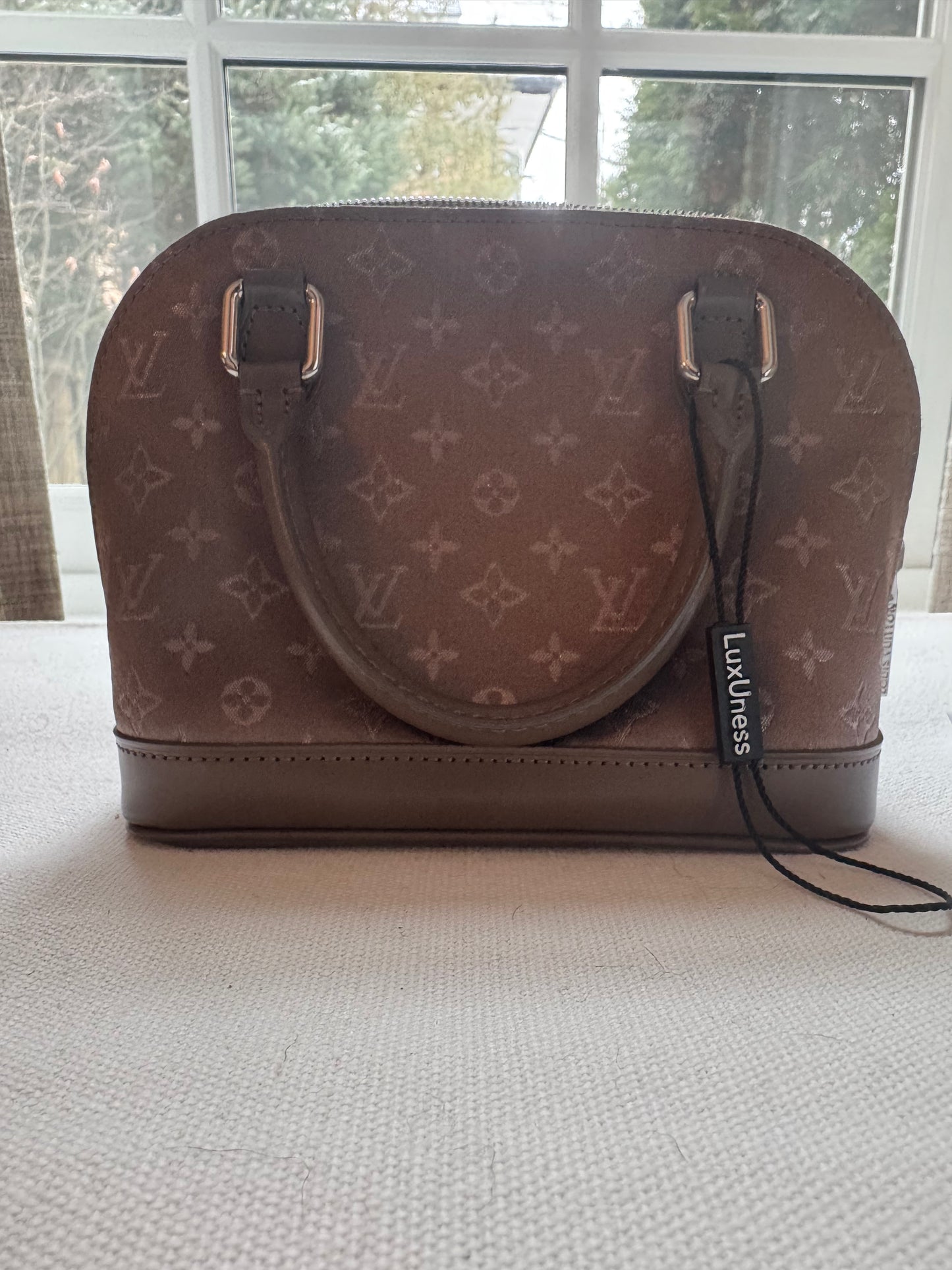 LOUIS VUITTON
Taupe Satin Monogram Mini Alma Nano