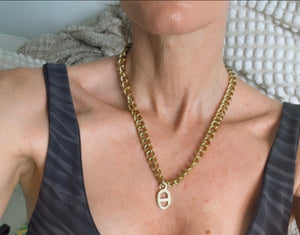 Upcycled sustainable Dior logo in gold on gold chain