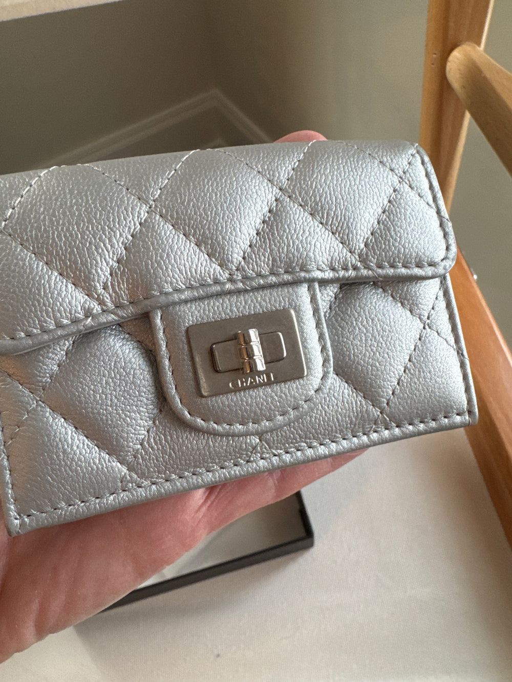 Chanel Matelasse small flap trifold wallet in silver . Boy turn lock