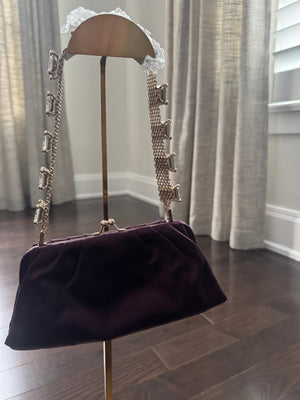 VALENTINO GARAVANI
Dark purple satin kiss logo clutch with embellished strap