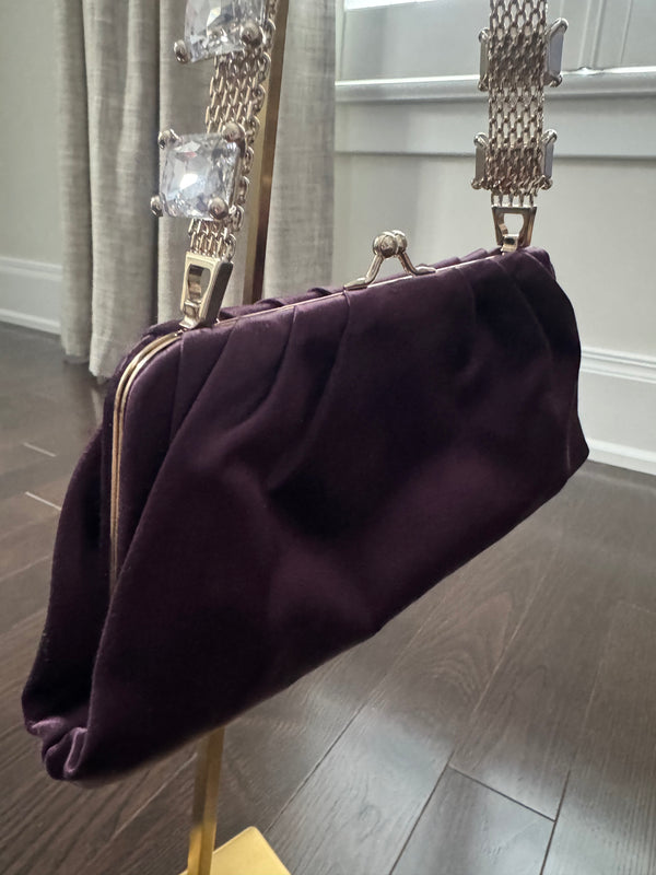 VALENTINO GARAVANI
Dark purple satin kiss logo clutch with embellished strap