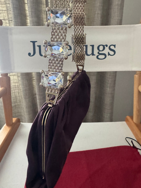 VALENTINO GARAVANI
Dark purple satin kiss logo clutch with embellished strap