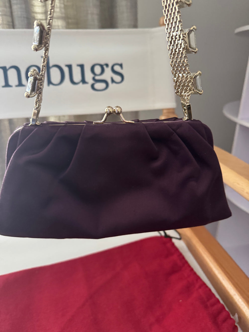 VALENTINO GARAVANI
Dark purple satin kiss logo clutch with embellished strap