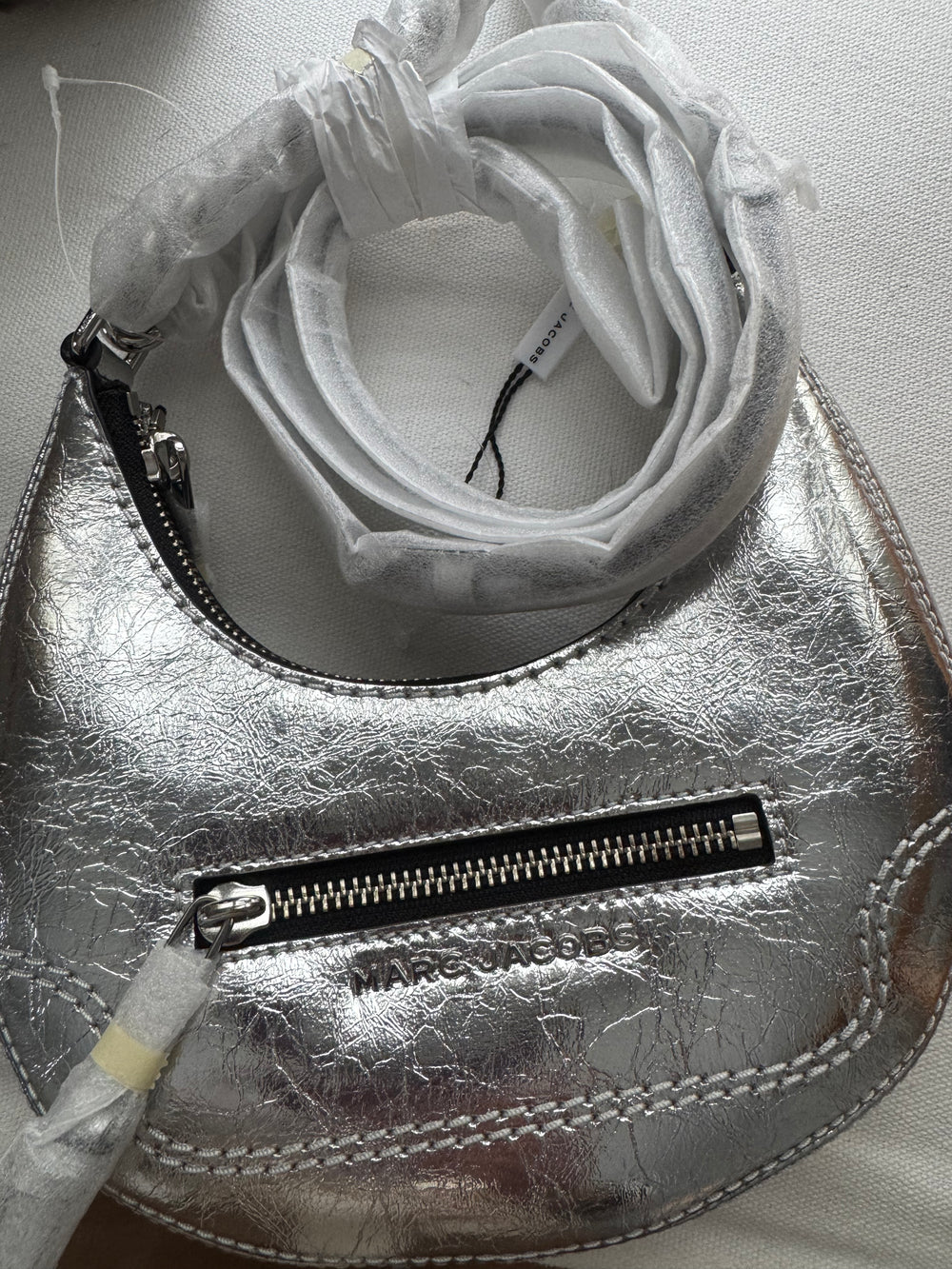 Marc Jacob’s Silver Croissant Bag.