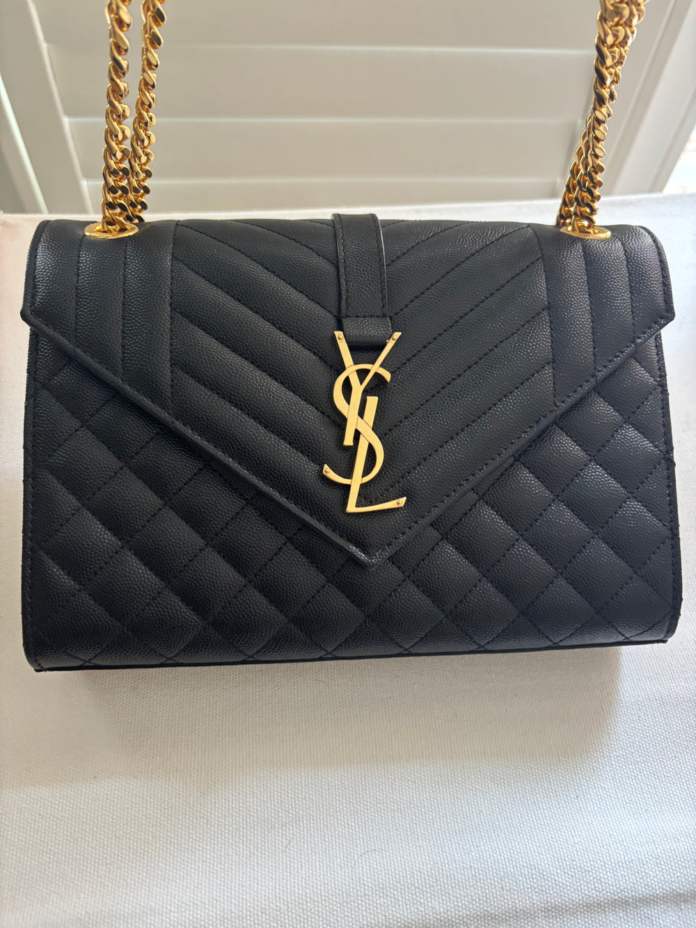 Saint Laurent Medium Envelope Chain Bag in black quilted leather with gold hardware