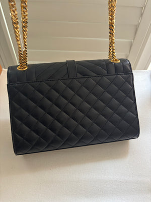 Saint Laurent Medium Envelope Chain Bag in black quilted leather with gold hardware